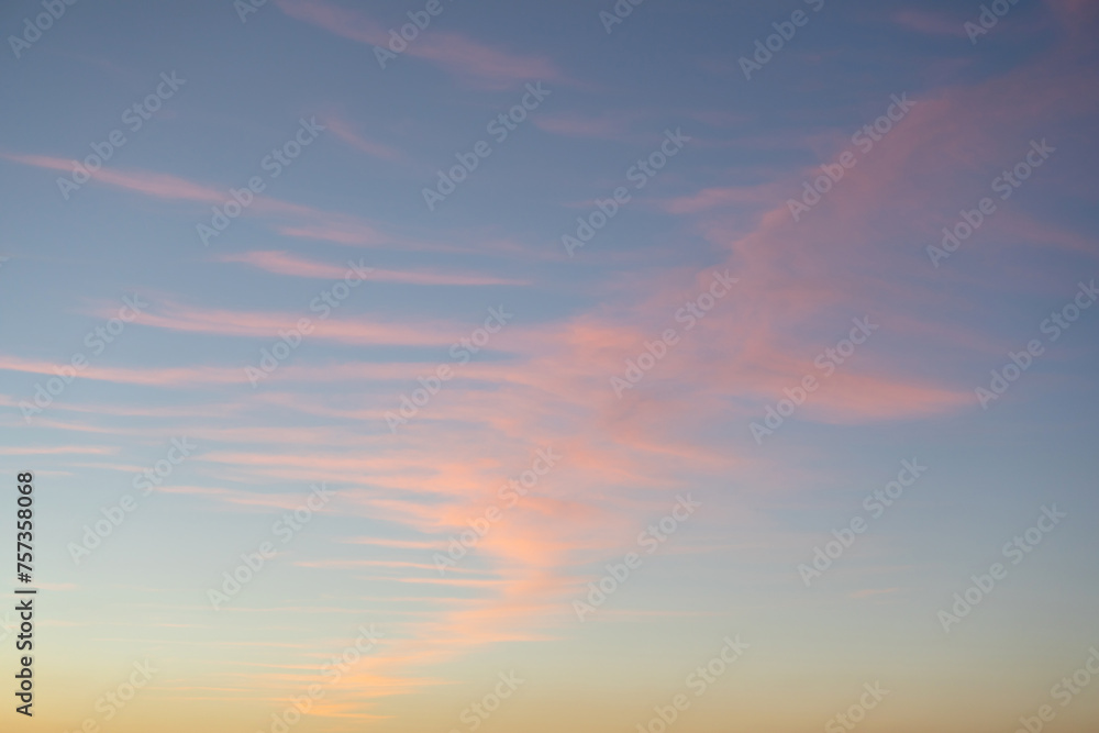 Pink cirrostratus clouds in the evening sky