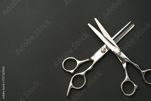 Hairdressing scissors on black background studio shot photo