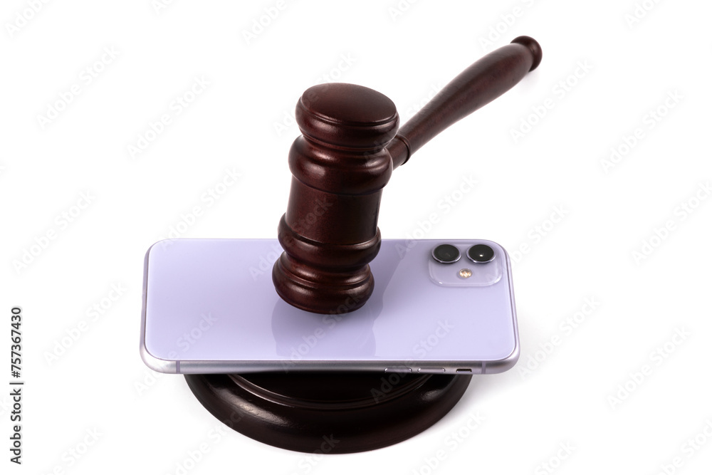 Modern smartphone and judge's gavel on a white background
