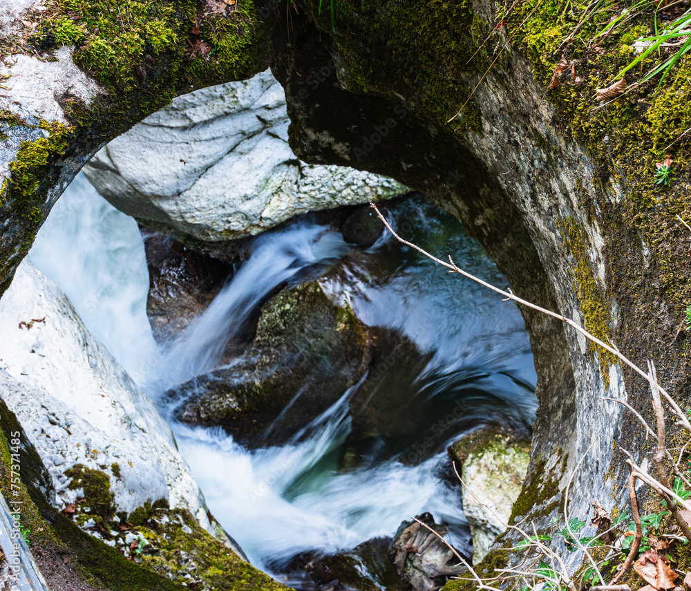 Hole in rocks showing stream strength in Gorges du Fier - obrazy, fototapety, plakaty 