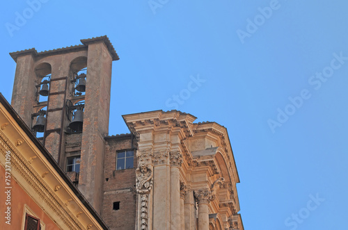 Roman campanile at the baroque Santa Maria in Campitelli church, also called Santa Maria in Portico, in Rome, with blue sky