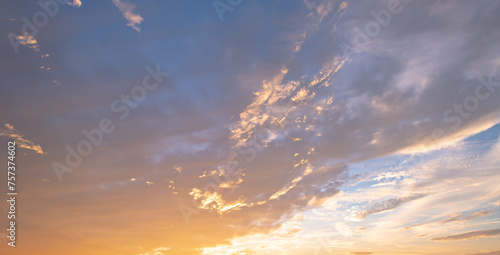 Fototapeta Naklejka Na Ścianę i Meble -  Sunset or sunrise. Dramatic majestic scenery sunset. Sky with clouds in sunset sky light background. Sunrise with clouds in various shapes. Calm sunset sky and sun through clouds over.