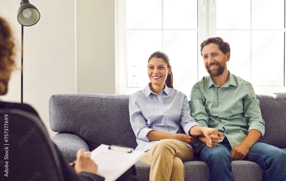 Happy family couple having a psychotherapy session. Man and woman go to therapy to find a solution to a problem and have a relationship full of harmony and positivity where they understand each other Happy family couple having a psychotherapy session. Man and woman go to therapy to find a solution to a problem and have a relationship full of harmony and positivity where they understand each other