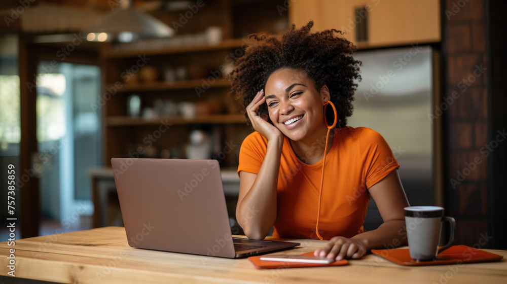 Cheerful woman working on laptop at home Cheerful woman working on laptop at home