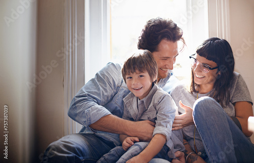 Portrait, laughing or family with child in home, house or apartment for support, care or love. Happy boy, funny mom or dad with kid or hug on holiday vacation, joke humor or relax together in England