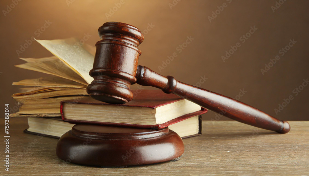Wooden gavel and books on wooden table, law concept Wooden gavel and books on wooden table, law concept