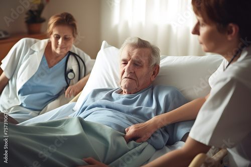 Elderly male hand holding hand young caregiver at nursing home. Care medical staff relatives. Geriatric doctor or geriatrician concept. Doctor physician on happy senior patient to comfort in hospital photo