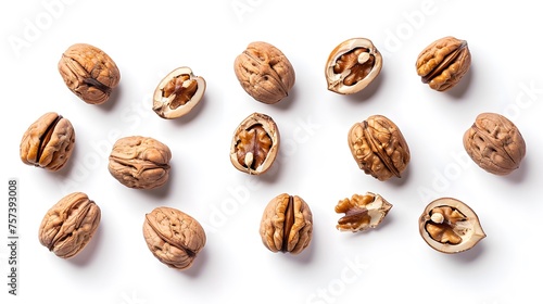 Cracked walnuts isolated on white background, top view