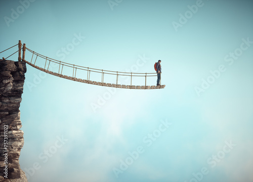 Surreal scene with a rope bridge cut in half suggesting the concept of dead end or impossible situation.