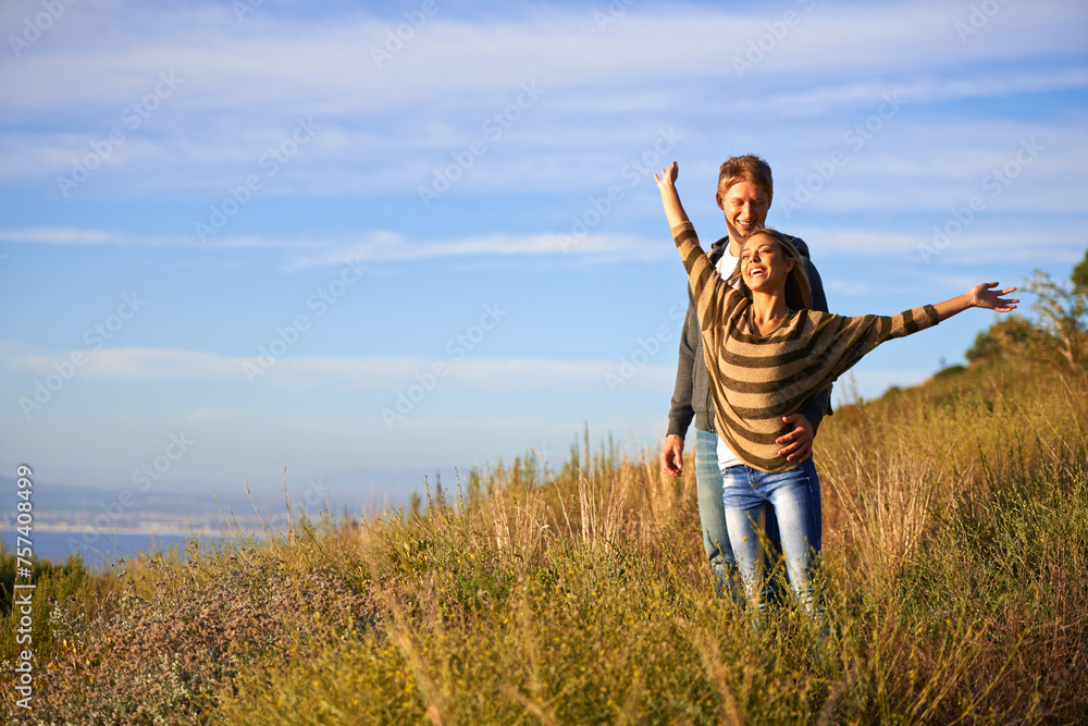 Spring, freedom and couple in nature, happy and bonding for holiday, vacation and trip to Amsterdam. Outdoor, man and woman together for love in field for anniversary of girl and male person Spring, freedom and couple in nature, happy and bonding for holiday, vacation and trip to Amsterdam. Outdoor, man and woman together for love in field for anniversary of girl and male person