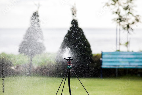 Spraying water in the courtyard photo