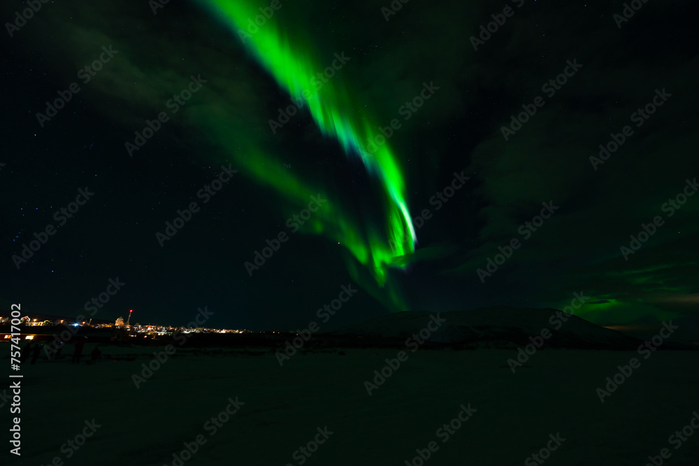 Aurora Borealis - Northern lights - above frozen lake Tornetrask in Abisko, Sweden