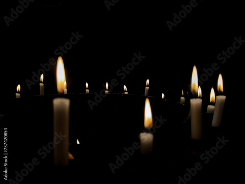 Wallpaper Mural row of isolated candles in the dark, black background Torontodigital.ca