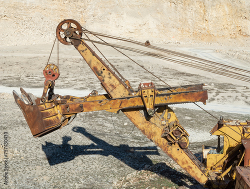 Old rusty equipment in limestone quarry in Europe