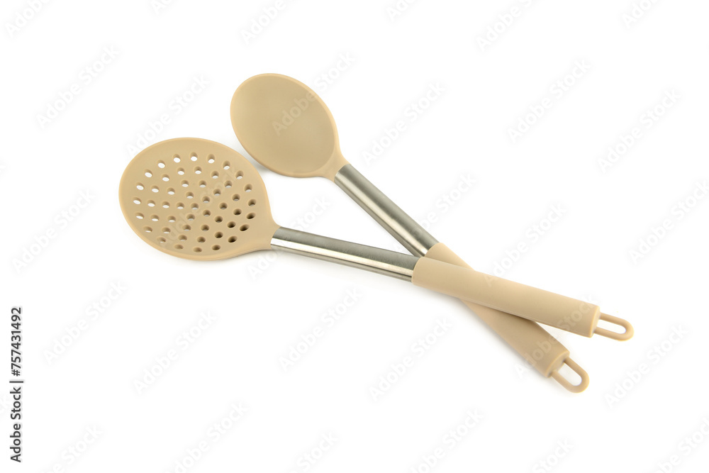 Kitchen slotted spoon and large spoon isolated on white .