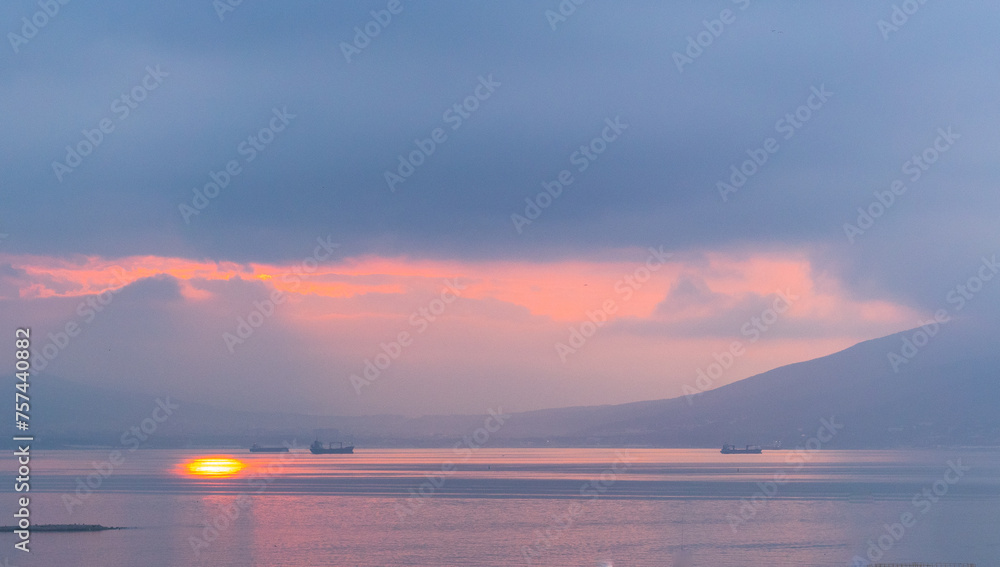 dawn over the sea with ships and sun dawn over the sea with ships and sun