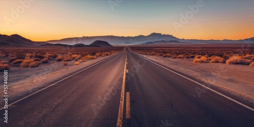 Open road in a vast desert landscape at sunset © ParinApril