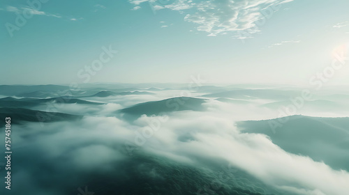 clouds over the mountains, Misty green hills under a soft, hazy sky. Serenity and nature concept. Design for tranquility, landscape beauty, and peaceful solitude. Abstract and dreamy background with a