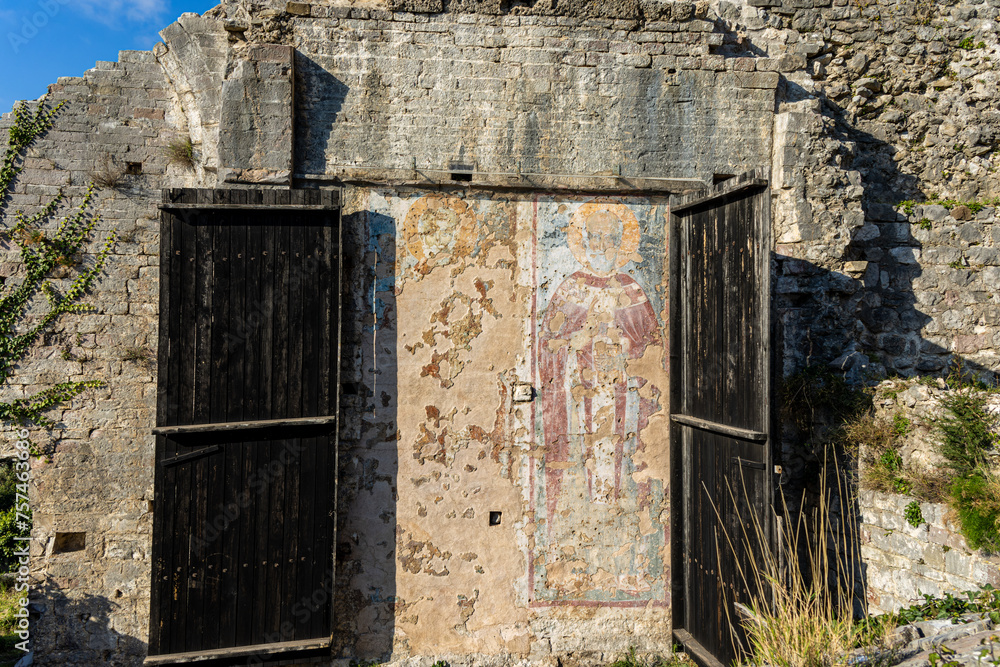 Fresco on the door of an old Orthodox church in a fortress in Europe Fresco on the door of an old Orthodox church in a fortress in Europe