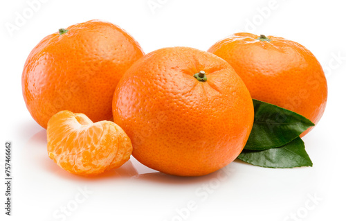 Three ripe tangerine with slices and green leaf isolated on white background