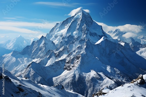 Snowcovered mountain against a blue sky, a stunning natural winter landscape