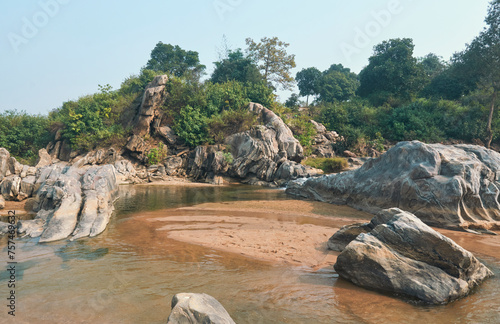 flow of Telwa river stream falling through levels of rocky terrain at Dharhara falls in Simultala, Bihar. Water level is knee-deep as flow of water is mostly dried-up in winter season. photo