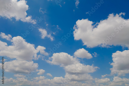 Fototapeta Naklejka Na Ścianę i Meble -  View of white clouds in the blue sky. Daylight, cloudy day. Nature, peaceful, cloudscape, abstract and freedom concept