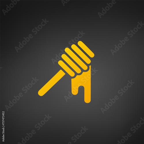 Honey dripping from wooden honey dipper on black background