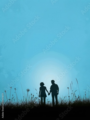 A couple is walking in a field with a blue sky in the background