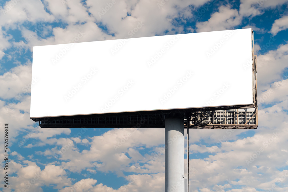 Blank wide horizontal white billboard mockup or large display against the blue sky with white clouds. Mock up, copy space, outdoor advertising, marketing, white screen and template concept Blank wide horizontal white billboard mockup or large display against the blue sky with white clouds. Mock up, copy space, outdoor advertising, marketing, white screen and template concept