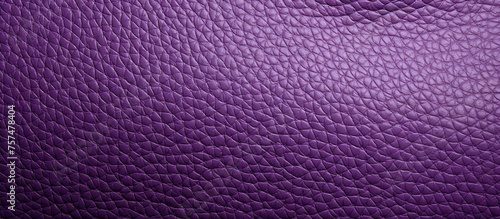 A close up of a vibrant purple leather texture with tints and shades of magenta, electric blue, and carmine, creating a mesmerizing pattern with symmetry. A true work of art