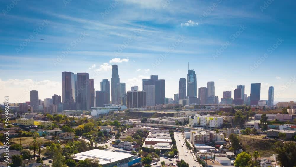 Flying into a vibrant downtown Los Angeles city skyline in aerial hyperlapse. Fun way to establish a very unique American City, one of the most famous urban locations in the world. Flying into a vibrant downtown Los Angeles city skyline in aerial hyperlapse. Fun way to establish a very unique American City, one of the most famous urban locations in the world.