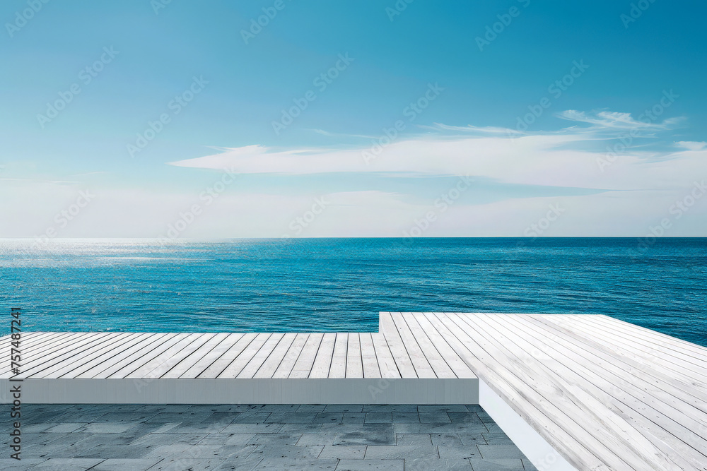 A beautiful blue ocean with a white dock and a wooden boardwalk, water is calm and the sky is clear