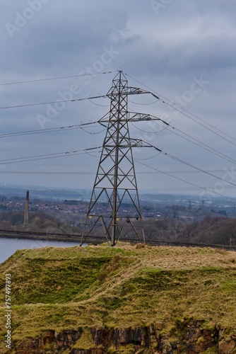 power lines in the field and town view