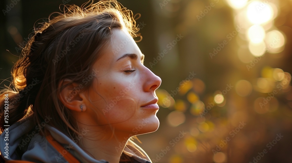 A serene woman inhaling the pure, fresh mountain air, stands amidst a tranquil natural setting, symbolizing a moment of mindfulness and self-care during a restorative hiking or meditation session A serene woman inhaling the pure, fresh mountain air, stands amidst a tranquil natural setting, symbolizing a moment of mindfulness and self-care during a restorative hiking or meditation session
