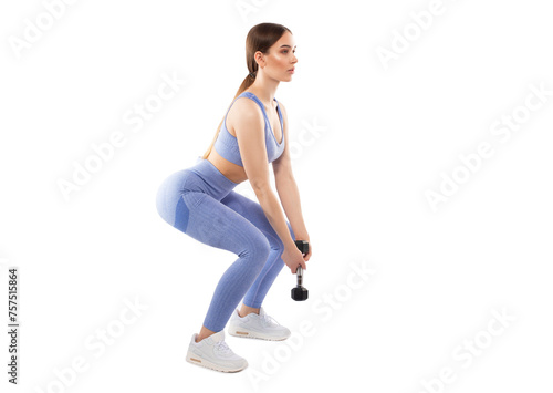 Slim, bodybuilder girl, lifts heavy dumbbell in the gym. Sports concept, fat burning and a healthy lifestyle.