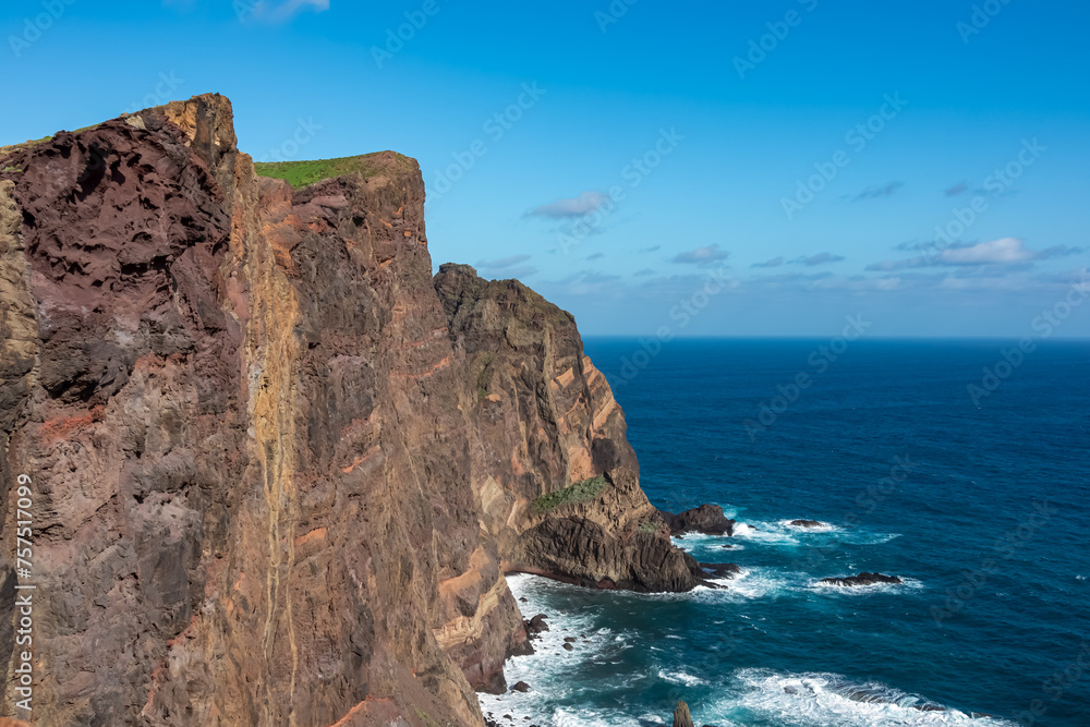 Panoramic view of majestic Atlantic Ocean coastline at Ponta de Sao Lourenco peninsula, Canical, Madeira island, Portugal, Europe. Coastal hiking trail along steep rocky rugged cliffs. Sea breeze. Awe