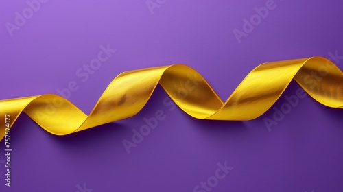 This is a simple yet elegant image of a gold ribbon on a purple background.