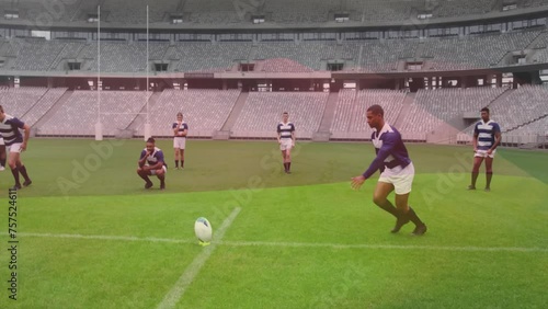 Animation of flag of germany over afrcain american male rugby kicking ball on pitch during match photo