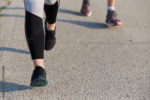 Close-Up: Athletic Runner's Legs Captured in Action on a Sunny Day.