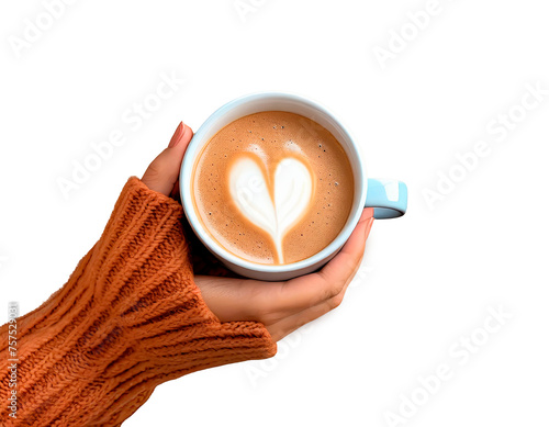 Close up of woman's hands in a cosy warm sweater holding a cup of coffee with milk. Image with transparent background png with Coffee Foam in the shape of a heart. Free for copy space.