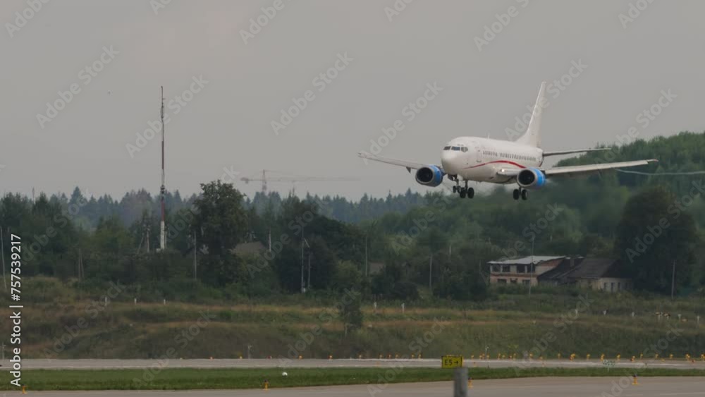 Jet airplane approaching before landing at Sheremetyevo, side view. Jet airplane approaching before landing at Sheremetyevo, side view.