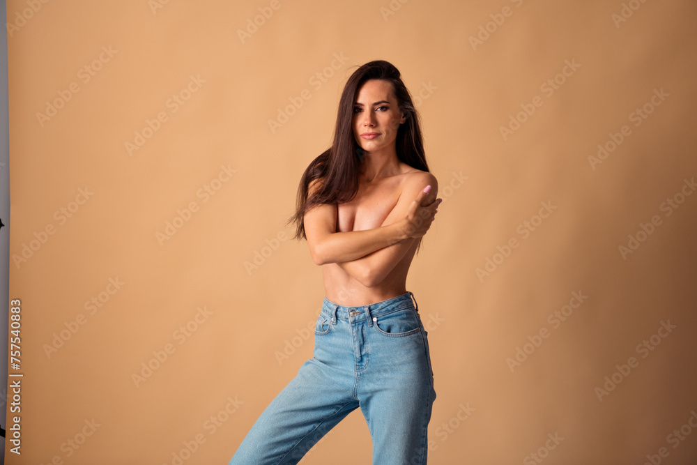 © deagreez - Unretouched photo of woman hug herself touch breast after mammography cancer checkup isolated pastel color background