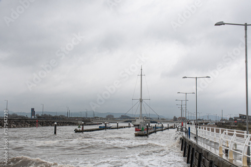 Rhyl harbour bridge with rough sea