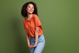 Photo of pretty excited lady dressed orange t-shirt laughing empty space isolated khaki color background