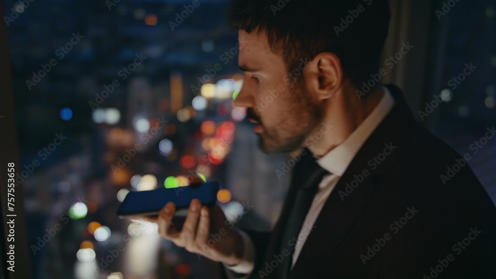 Aggressive manager yelling phone standing office at night close up. Mad ceo call Aggressive manager yelling phone standing office at night close up. Mad ceo call