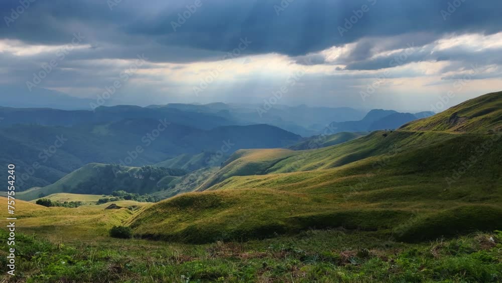 Gumbashi Pass, the highest mountain pass in Russia. View of the green mountains and hills at sunset. Beautiful summer landscape in the North Caucasus. Beautiful epic view of the valley.Evening Gumbashi Pass, the highest mountain pass in Russia. View of the green mountains and hills at sunset. Beautiful summer landscape in the North Caucasus. Beautiful epic view of the valley.Evening