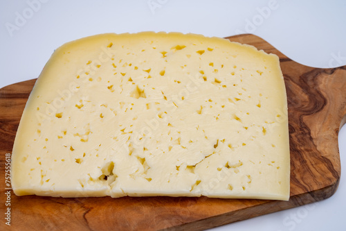 Fresh Asiago cow's milk cheese, from Asiago in Italy, used in panini or sandwiches or melted on variety of dishes, classified as a Swiss-type Alpine cheese photo