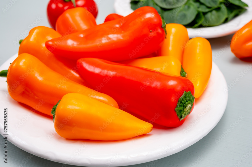 Fresh red, orange, and yellow sweet bell paprika close up Fresh red, orange, and yellow sweet bell paprika close up