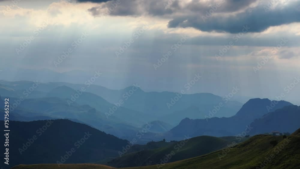 Gumbashi Pass, the highest mountain pass in Russia. View of the green mountains and hills at sunset. Beautiful summer landscape in the North Caucasus. Beautiful epic view of the valley.Evening Gumbashi Pass, the highest mountain pass in Russia. View of the green mountains and hills at sunset. Beautiful summer landscape in the North Caucasus. Beautiful epic view of the valley.Evening